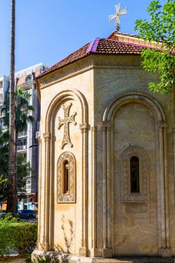 travel to Georgia - cross on Church of St. Barbara on Rustaveli Avenue in Batumi city in autumn morning. St Barbara Church was founded in 1888, by the military hospital clipart