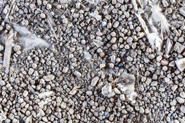 top view of expanded clay and garbage on polyethylene film on floor of attic in village house clipart