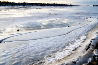 frozen river in Kostroma city in winter evening twilight