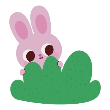 Gülümseyen pembe tavşan çalıların üzerinde