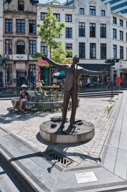 A bronze statue of the singer Jacques Brel, sculpted by the artist Tom Frantzen, in the square of Brussels, Belgium clipart