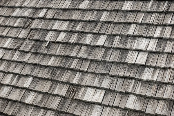 stock image old weathered roof shingles from a house in the mountains