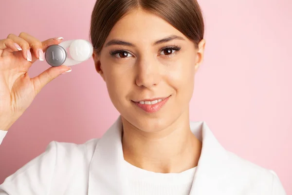 stock image Female doctor hands giving pair of contact lens in case to patient offering choice