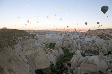 Cappadocia hot air baloon trip, Turkey. Tourists on board Hot air baloons are flying over Cappadocia