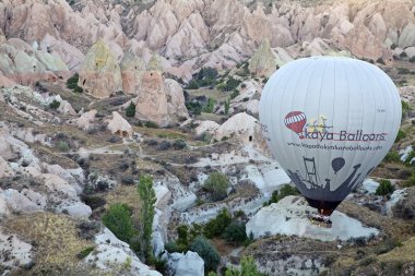 Cappadocia hot air baloon trip, Turkey. Tourists on board Hot air baloons are flying over Cappadocia