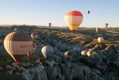 Cappadocia hot air balloon trip, Turkey. Hot air balloons are flying over Cappadocia