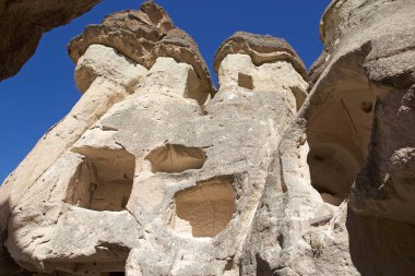 Cave home and church rock formations of the Fairy Chimney in Goreme National Park, a small village in Central Anatolia, Turkey