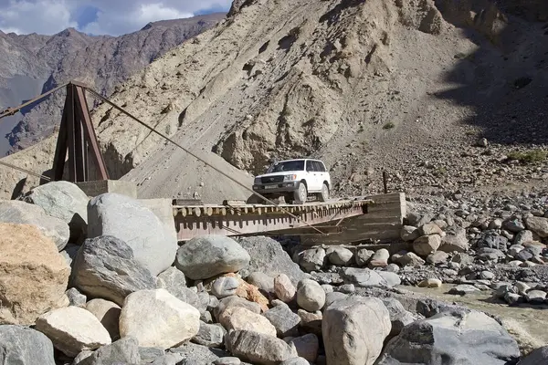 stock image Road among the Pamir mountains in the Gorno-Badakhshan in Tajikistan. The Badakhshan is an autonomous region in eastern Tajikistan, in the Pamir Mountains