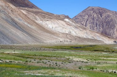 Mountains along the Bartang Valley in the Gorno-Badakhshan in Tajikistan. The Badakhshan is an autonomous region in eastern Tajikistan, in the Pamir Mountains clipart