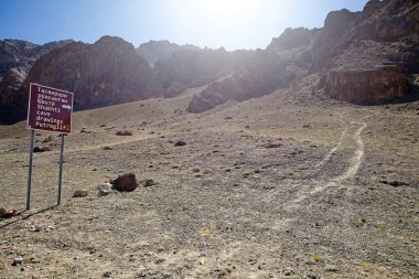 Shakhti Cave drawings Petroglif, Tajikistan. The site is 50 km southwest of Murghab in the Kurteskei Valley clipart