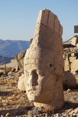 Head of Antiochus at West terrace at the Mount Nemrut in southeatern Turkey in notable for the summit where a number of large statues are erected around what is assumed to be a royal tomb from the 1st century BC. It was designated a UNESCO World Heri clipart