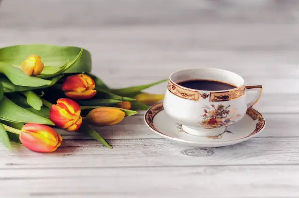 A bouquet of tulips and morning coffee