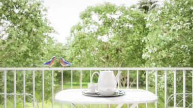 Modern style living room 3d with outdoor terrace and nature view render,decorate with brown fabric  sofa,There are large open folding doors, The curtains swayed with the wind blowing into the room