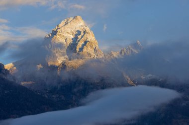 a scenic landscape at dawn in the Tetons in autumn