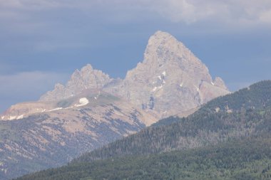 a scenic landscape of the Teton Range in Idaho in summer