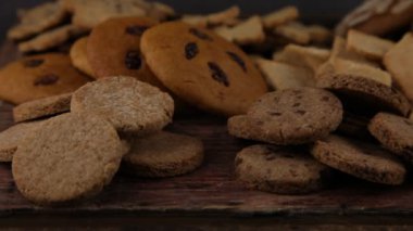 Set of different homemade cookies. Cookie close-up. Background from delicious pastries. Cookies with coconut, mishdal, chocolates, raisins, lingonberries. Round rhombuses, bears flowers shapes.