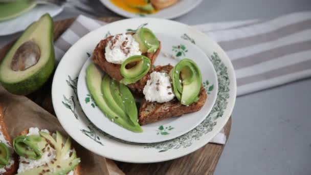 Sandwiches Avocado Soft Cheese Sprinkled Flax Sesame Seeds Breakfast Table — Wideo stockowe