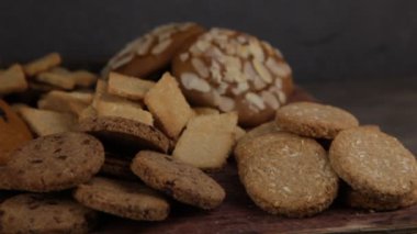 Set of different homemade cookies. Cookie close-up. Background from delicious pastries. Cookies with coconut, mishdal, chocolates, raisins, lingonberries. Round rhombuses, bears flowers shapes.