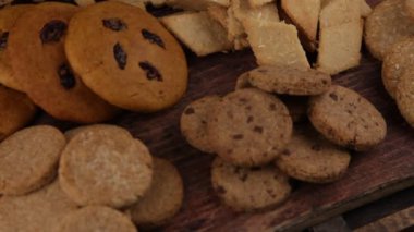 Set of different homemade cookies. Cookie close-up. Background from delicious pastries. Cookies with coconut, mishdal, chocolates, raisins, lingonberries. Round rhombuses, bears flowers shapes.
