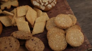 Set of different homemade cookies. Cookie close-up. Background from delicious pastries. Cookies with coconut, mishdal, chocolates, raisins, lingonberries. Round rhombuses, bears flowers shapes.