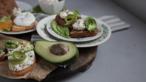 Sandwiches Avocado Soft Cheese Sprinkled Flax Sesame Seeds Breakfast Table — Stockvideo