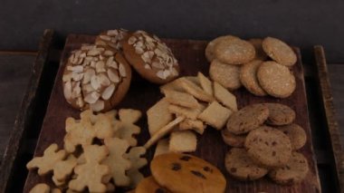Set of different homemade cookies. Cookie close-up. Background from delicious pastries. Cookies with coconut, mishdal, chocolates, raisins, lingonberries. Round rhombuses, bears flowers shapes.