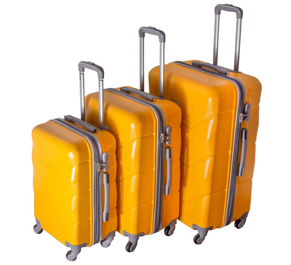 Набор желтых чемоданов на колесах. Багаж. Чемодан для путешествий на белом фоне.