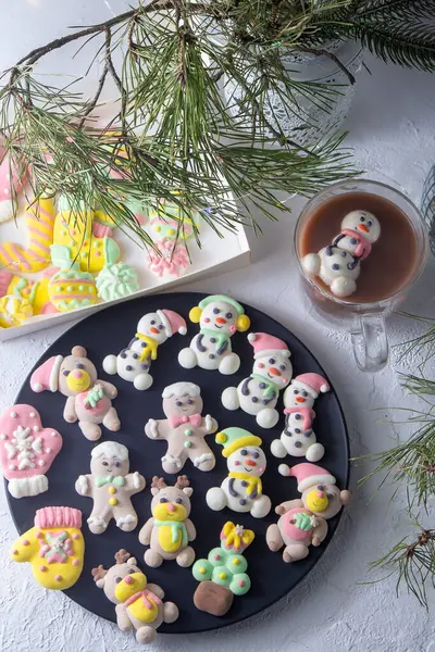 Christmas marshmallows. Winter candy. Sweet food in december. Snowman and Santa Claus