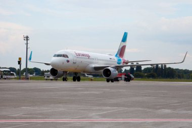 Passenger plane of the German airline Eurowings. European low-cost. Airport apron. Germany airplane. Aircraft Airbus A320-214 D-AEWU Airplane runway. Ukraine, Kyiv - September 1, 2021. clipart