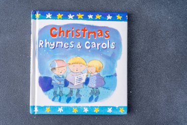 Christmas Rhymes and Carols book for kids by Lois Rock. Ukraine, Kyiv - March 16, 2024 clipart