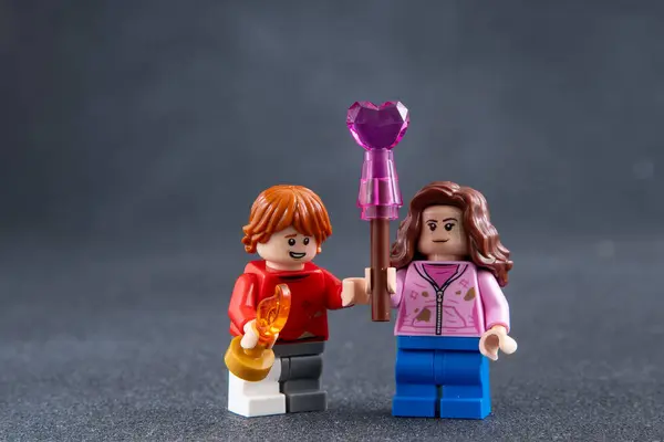 Stock image Ron and Hermione. Lego Harry Potter minifigures. Childrens designer toy made of bricks and plastic parts. Ukraine, Kyiv - January 17, 2024.