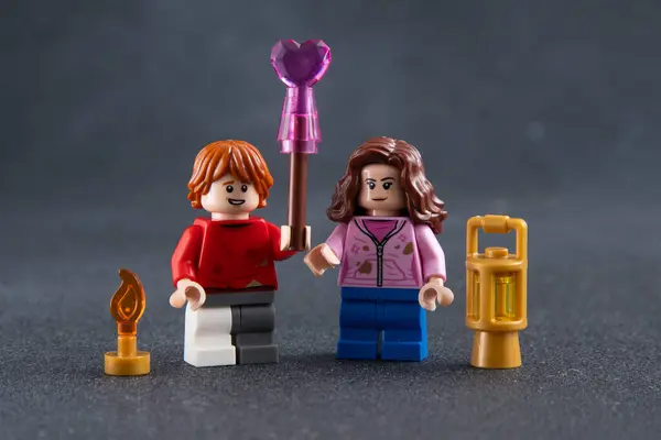 Stock image Ron and Hermione. Lego Harry Potter minifigures. Childrens designer toy made of bricks and plastic parts. Ukraine, Kyiv - January 17, 2024.