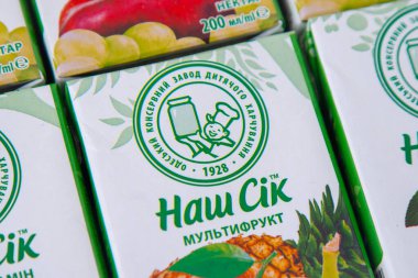 Childrens juice in a tetra pack Nash Sik -Our juice. Odesa baby food factory logo. Drink in a box with a straw. Ukraine, Kyiv - January 16, 2024. clipart