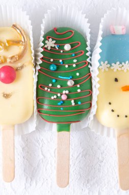 Homemade Cakesicles. Christmas food. Sweet candy. Snow man and dear clipart