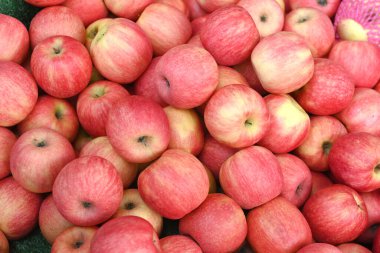 A large group of ripe red apples background