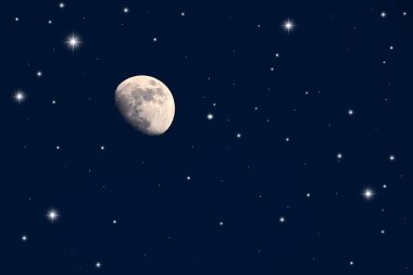 Gece gökyüzü ay ve yıldızlarla.
