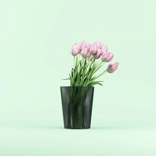 一束花粉红郁金香放在绿色背景工作室的黑色回收箱上 3D渲染 创意创意概念 免版税图库照片