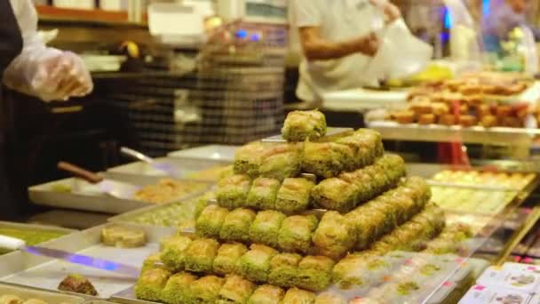 Stacks Baklava Foreground Hands Unrecognizable Seller Serves Customers Traditional Turkish — Stock Video