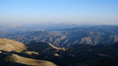 Panoramic view of Nemrut Mount and Taurus Mountains. Sunrise above Nemrut National park. UNESCO World Heritage Site. Adiyaman province, Turkey 
