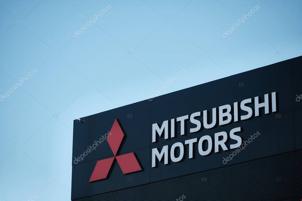 Mitsubishi motors logo at car dealer center illustrative editorial
