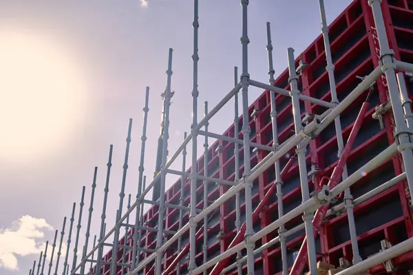 Stock image Vertical panel formwork, push-pull jacks and scaffoldings of reinforced concrete walls under construction. Structures for cast in place reinforced concrete