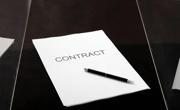 stock image Transparent contract. A contract printed on paper and a pen lies in a glass box close-u