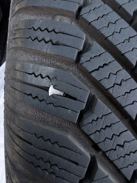 Button head needle metal nail stuck to puncture into wheel tire - winter flat tire flat