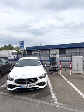 Kehl, Germany - Apr 23, 2022: Charging white Mercedes-Benz - luxury electric car