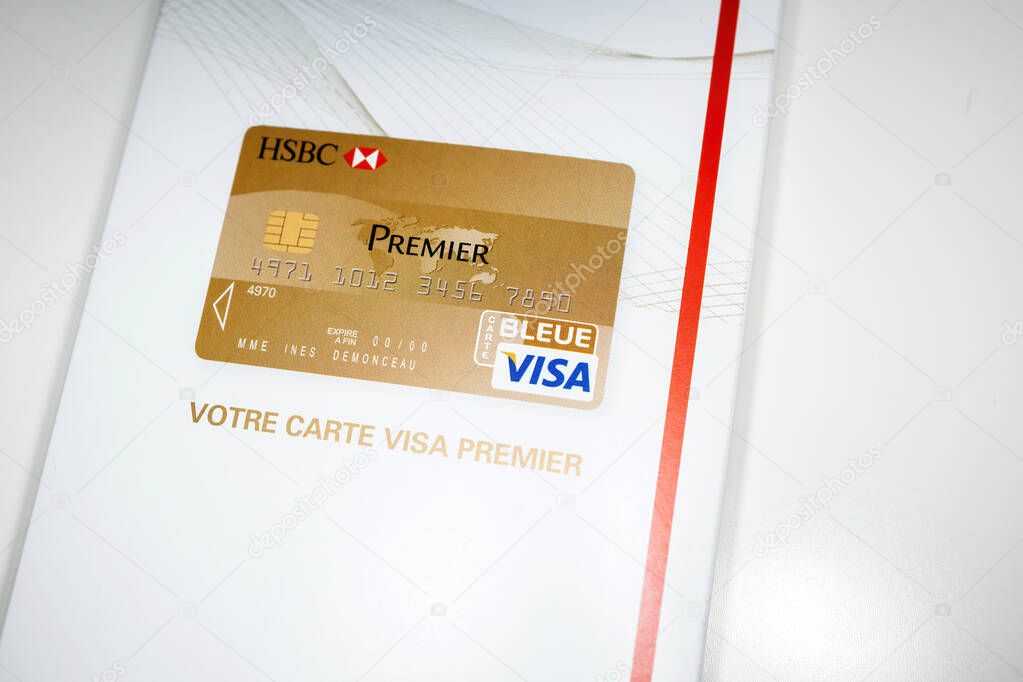 London, United Kingdom - Jan 14, 2015: HSBC Visa Premier luxury card white envelope with HSBC logotype on it - Hongkong and Shanghai Banking Corporation is a British multinational universal bank