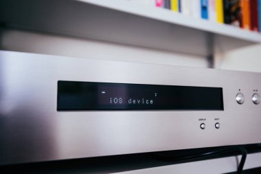Paris, France - Dec 13, 2022: Setting up iOS device on the display of new Onkyo NS-6170 network audio player with DSD Hi-Res Audio and DSD DAB WIFI - display input button