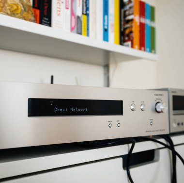 Paris, France - Dec 13, 2022: Check network message on new Onkyo NS-6170 network audio player with DSD Hi-Res Audio and DSD DAB WIFI device during first setup