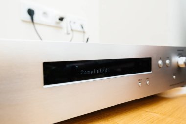 Paris, France - Dec 13, 2022: Completed message on dot matrix display on the device Onkyo NS-6170 network audio player with DSD Hi-Res Audio and DSD DAB WIFI during first setup