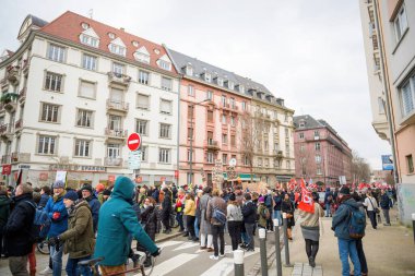 Strasbourg, France - Jan 19, 2023: Large crowd with placards at protest against the French governments planned pension reform to push the retirement age from 62 to 64 unions have called for mass