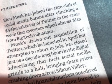 Paris, France - Oct 29, 2022: Close-up of Financial Times newspaper with article about Elon Musk taking the elite club of social media barons after clinching a 44bn takeover of Twitter
